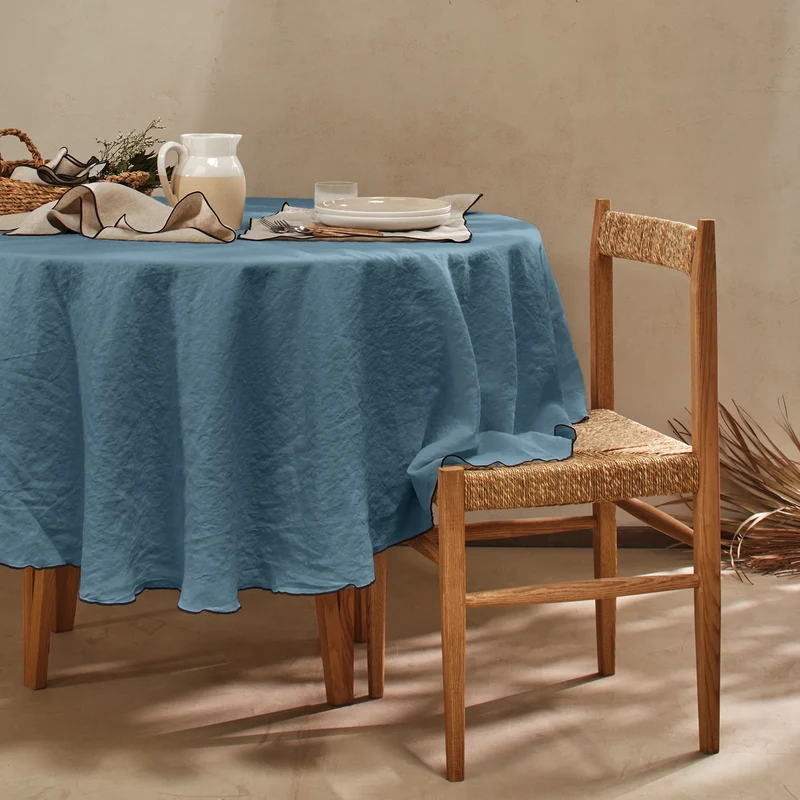 Mantel redondo con bourdon de lino lavado azul francés