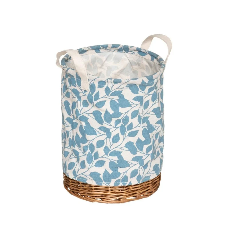 Cesta redonda de mimbre y tela floral.