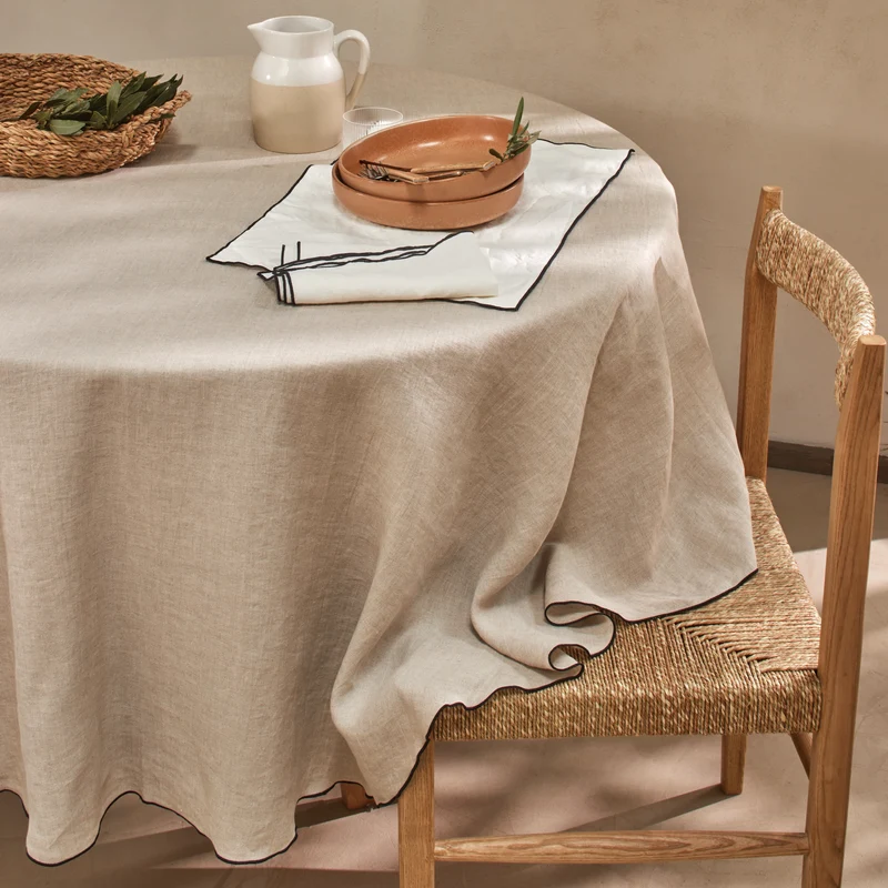 Mantel redondo con bourdon de lino lavado natural