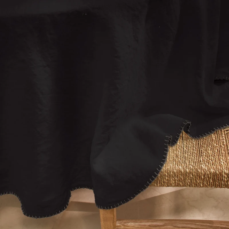 Mantel redondo punto de festón de lino lavado tinta negra